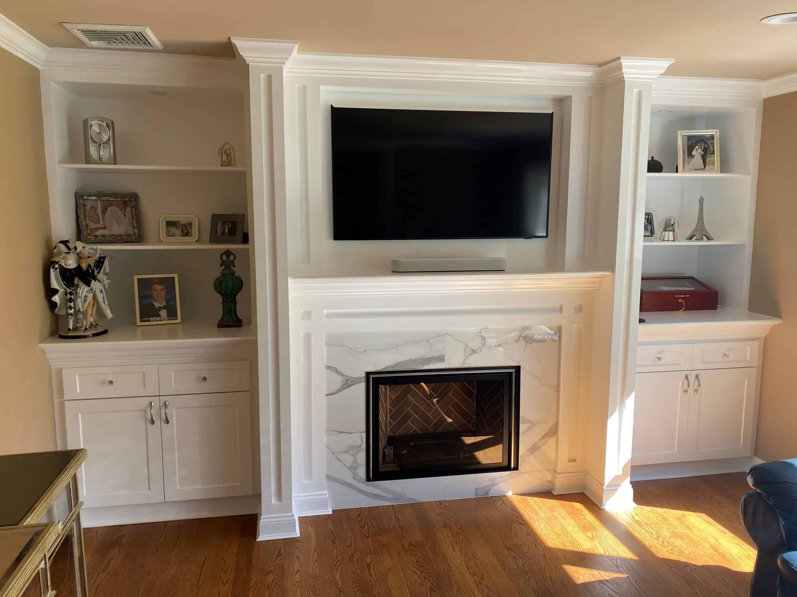 Completed Fireplace, mantel, and bookcases by Panther Siding and Windows.