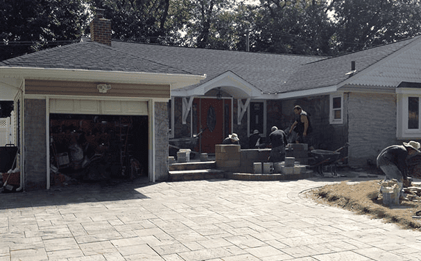 three workers doing masonry